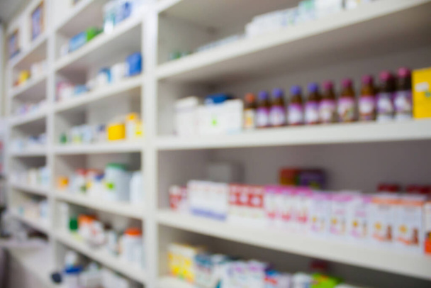 pharmacy store drugs shelves interior blurred background - Photo, Image