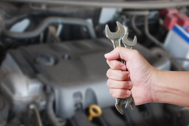 Car service. Hand holding wrench. - Photo, Image