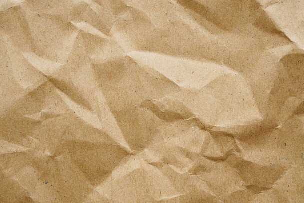 Bruin verfrommeld papier gerecycled kraftpapier textuur achtergrond - Foto, afbeelding