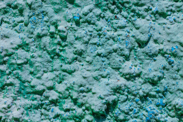 Old turquoise plaster wall texture. Retro painted putty building background with copy space. Stylish blue surface, detailed stones backdrop. Wallpaper textured screensaver front view for text design. - Photo, Image