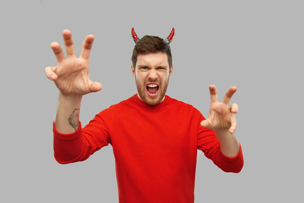 man in halloween costume of devil scaring - Foto, Imagen