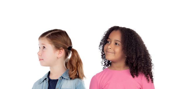 Two adorable girls thinking about something isolated on a white background - Photo, Image