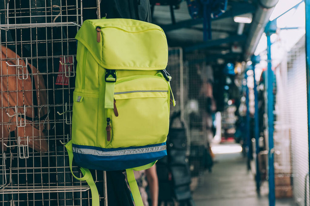 A yellow backpack is being sold in the market - Foto, immagini