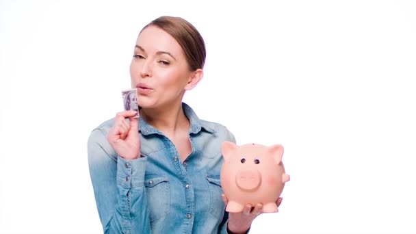 Woman Put Banknote Into Piggy Bank - Footage, Video