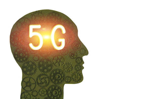 Logo of 5G networks in the silhouette of a human head on the background of gears. Concept of progress - 写真・画像