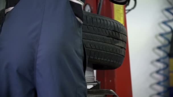 Vulcaniser checks the tire - Footage, Video