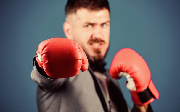 powerful man boxer ready for corporate battle. businessman in formal suit and bow tie. Business and sport success. bearded man in boxing gloves punching. knockout and energy. Fight. Great progress - Foto, imagen