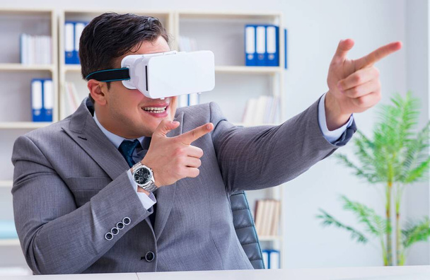 Businessman with virtual reality glasses in modern technology co - Fotoğraf, Görsel