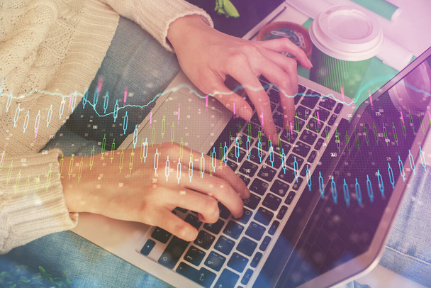 Double exposure of woman hands typing on computer and forex chart hologram drawing. Stock market invest concept. - Fotoğraf, Görsel