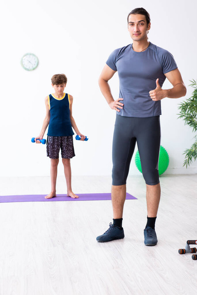Young father and his son doing exercises - Photo, Image