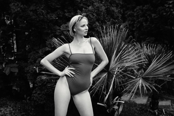 young beautiful woman posing in swimsuit - 写真・画像