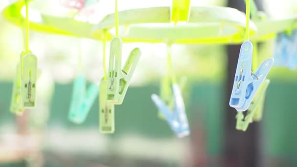 Plastic hanging clothespin, Many plastic clothespins on the clothesline, laundry Concept - Footage, Video