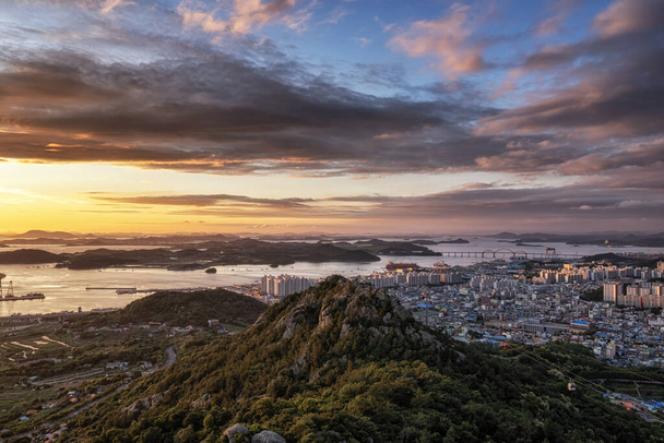 The sunset view and the Mokpo city over the Yudalsan mountain located in Mokpo, South Korea. Taken right after the monsoon season - Photo, Image