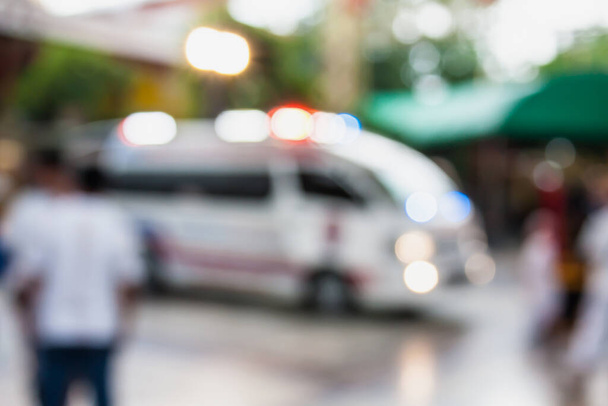 Ambulance responding to an emergency call blurred background - Foto, immagini