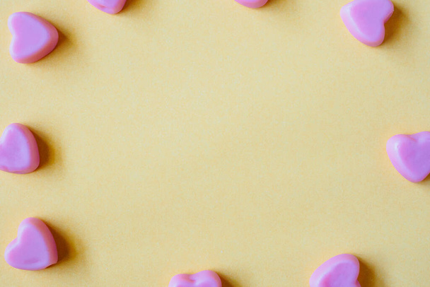 Valentines day background with heart shape candy on yellow background - Fotoğraf, Görsel