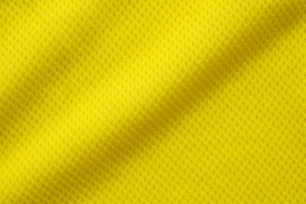Colore giallo calcio jersey abbigliamento tessuto texture sport usura sfondo, primo piano - Foto, immagini