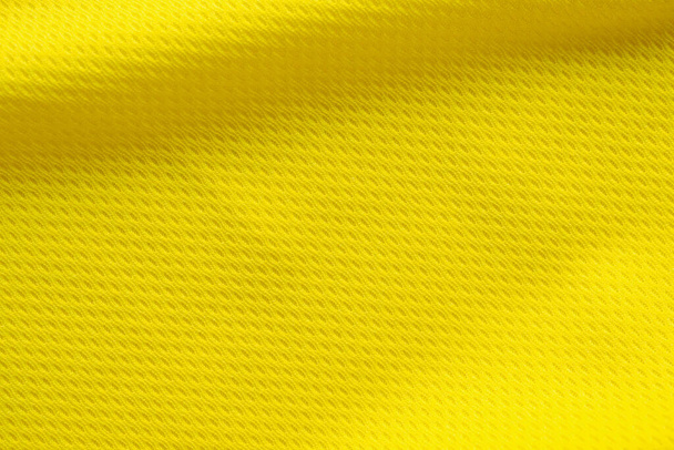 Keltainen väri jalkapallo jersey vaatteet kangas rakenne urheilu kulumista tausta, lähikuva - Valokuva, kuva