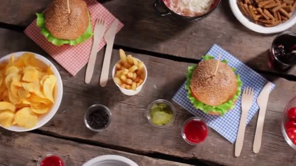 noodles with burgers and vegetables food with sauces on table - Footage, Video