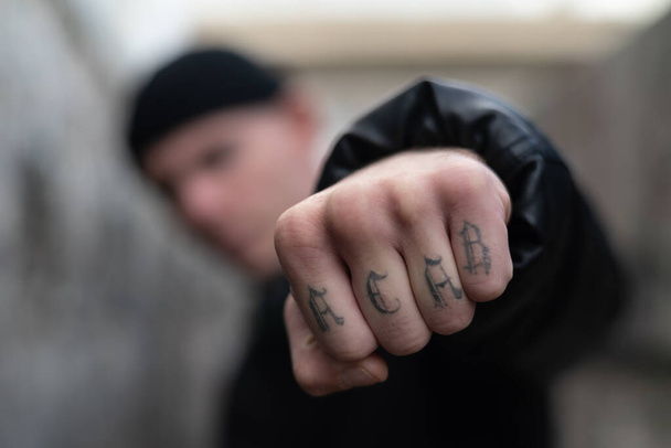 ACAB tattoo on the arm of a bully man - 写真・画像