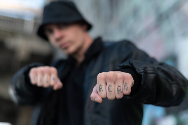 ACAB tattoo on the arm of a bully man - Фото, изображение