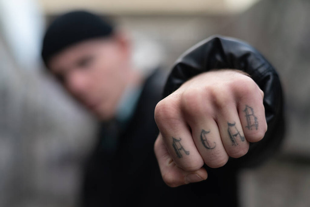 ACAB tattoo on the arm of a bully man - Foto, afbeelding