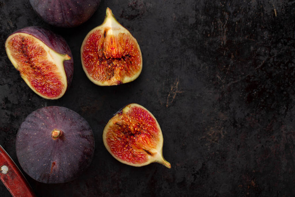 Fresh ripe figs in on a dark background. Healthy food. - Photo, Image