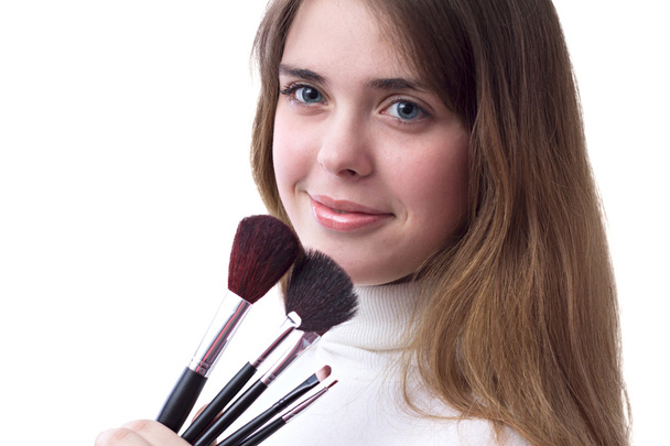 beautiful girl with a set of brushes for makeup in her hands - Foto, Imagem