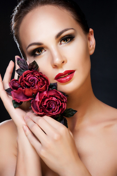 Brunette with make-up and flowers - 写真・画像