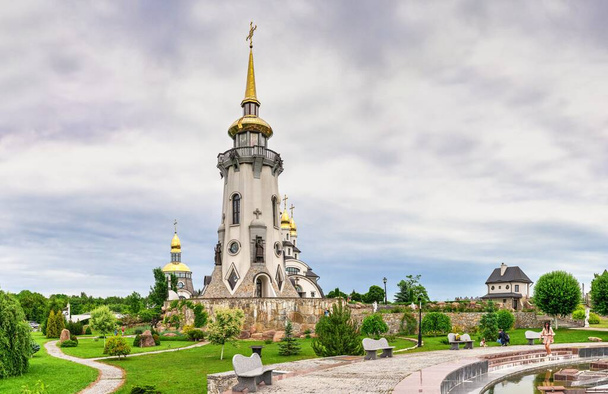 Buki, Ukraine 06.20.2020. Temple Complex with landscape Park in Buki, Ukraine, on a cloudy summer day - 写真・画像