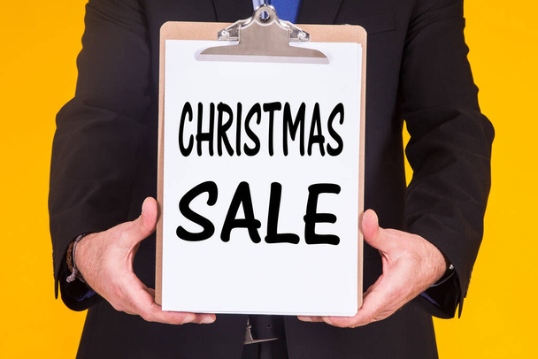 businessman with sales banner and Christmas discounts - Zdjęcie, obraz