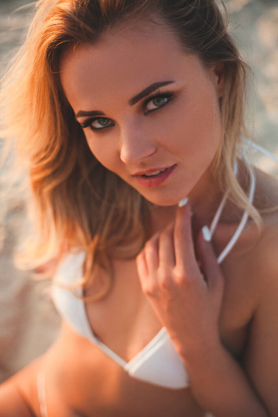 Young sexy blonde on the beach - Фото, зображення