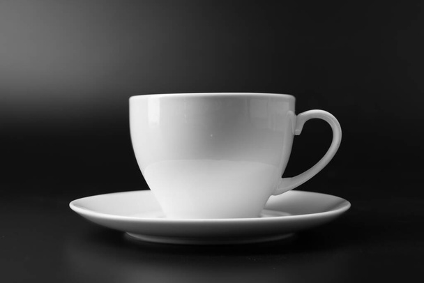 white ceramic mug isolated on black background - Foto, imagen