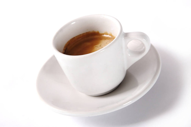 A closeup shot of white cup of ristretto on white background - Fotó, kép