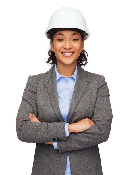 Businesswoman in white helmet with crossed arms - Foto, Bild
