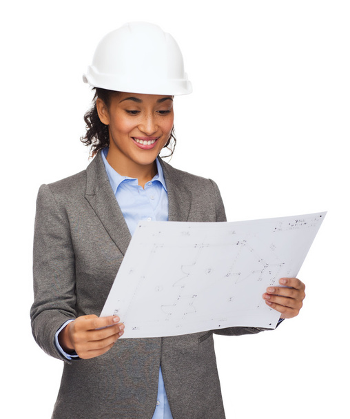 Businesswoman in white helmet with blueprint - Фото, зображення