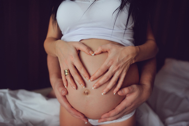 Tummy of a pregnant girl - Фото, изображение