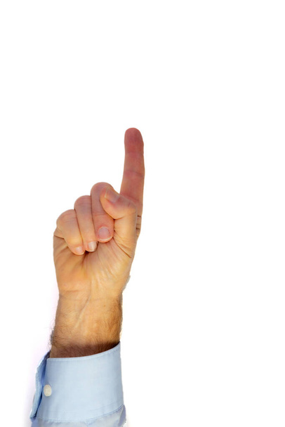 A vertical isolated shot of a human hand with the fingers pointing up in front of a white background - Foto, immagini