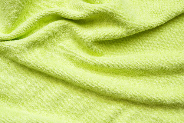 Tejido de toalla verde textura superficie primer plano fondo - Foto, imagen