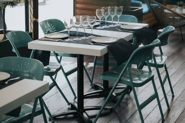 A table set for dinner in a cozy restaurant - Fotografie, Obrázek