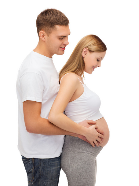 Happy young family expecting child - Фото, зображення