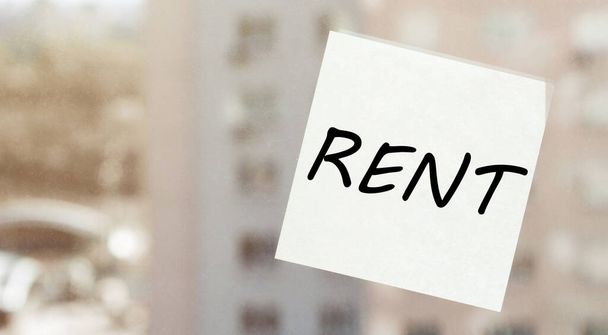 white paper with text RENT on the window - Photo, Image