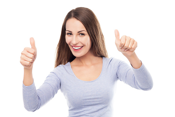 Young woman with thumbs up - Photo, image