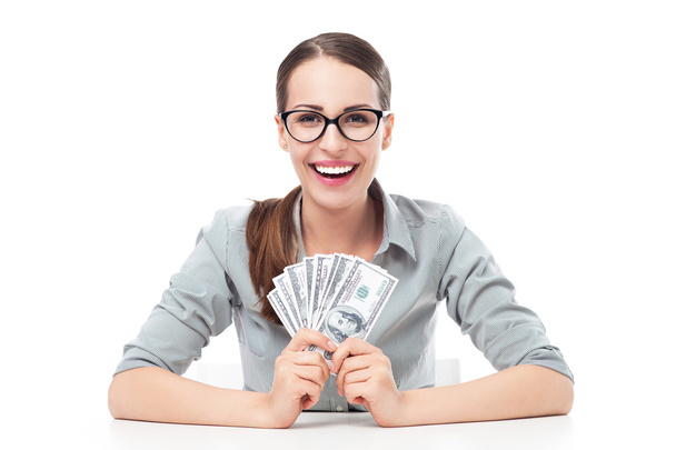 Female holding a fan of money - Foto, immagini