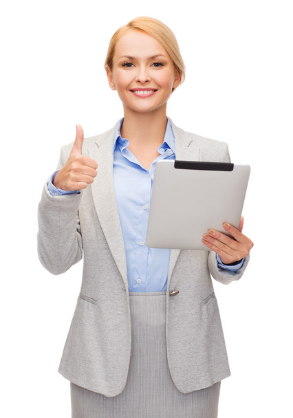 Smiling woman with tablet pc showing thumbs up - Φωτογραφία, εικόνα