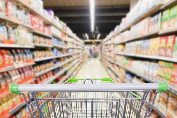 Supermarket aisle with empty shopping cart business concept - Photo, Image
