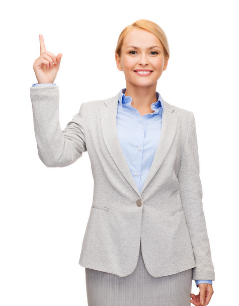 Smiling businesswoman with her finger up - Valokuva, kuva