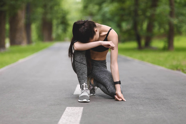Exhausted Asian Jogger Girl Resting On Path In Park After Long Run - Photo, Image