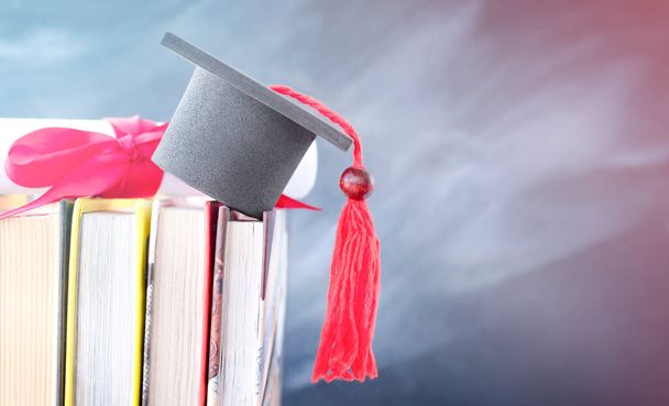 diploma and graduate cap on books - Photo, Image