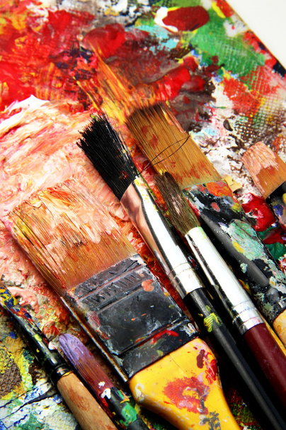 Beautiful vivid art palette and mix of paintbrushes - Fotografie, Obrázek