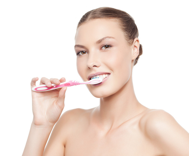 woman brushing her teeth - Photo, image